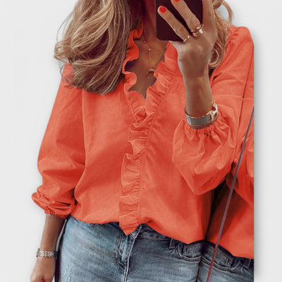 Castorini™ | Una Blusa Elegante